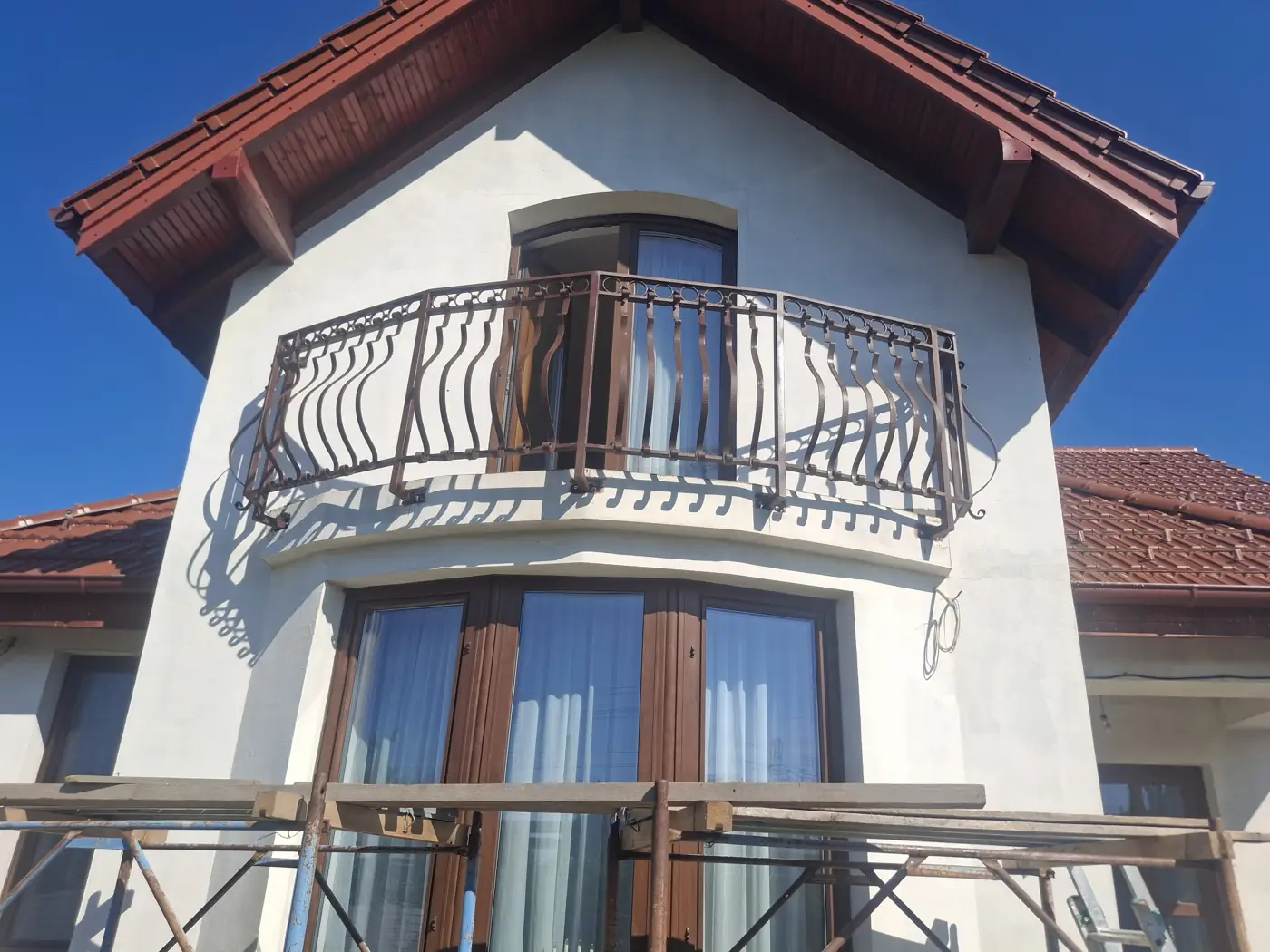 Metal balcony railing installed on a house
