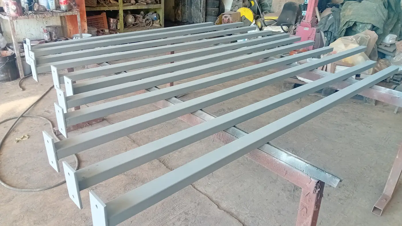 Painted steel sections in the workshop, ready for assembly